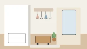 Przedpokój w bloku z jasną zabudową, lustrem i siedziskiem, pokazujący praktyczny układ do małej przestrzeni w mieszkaniu.